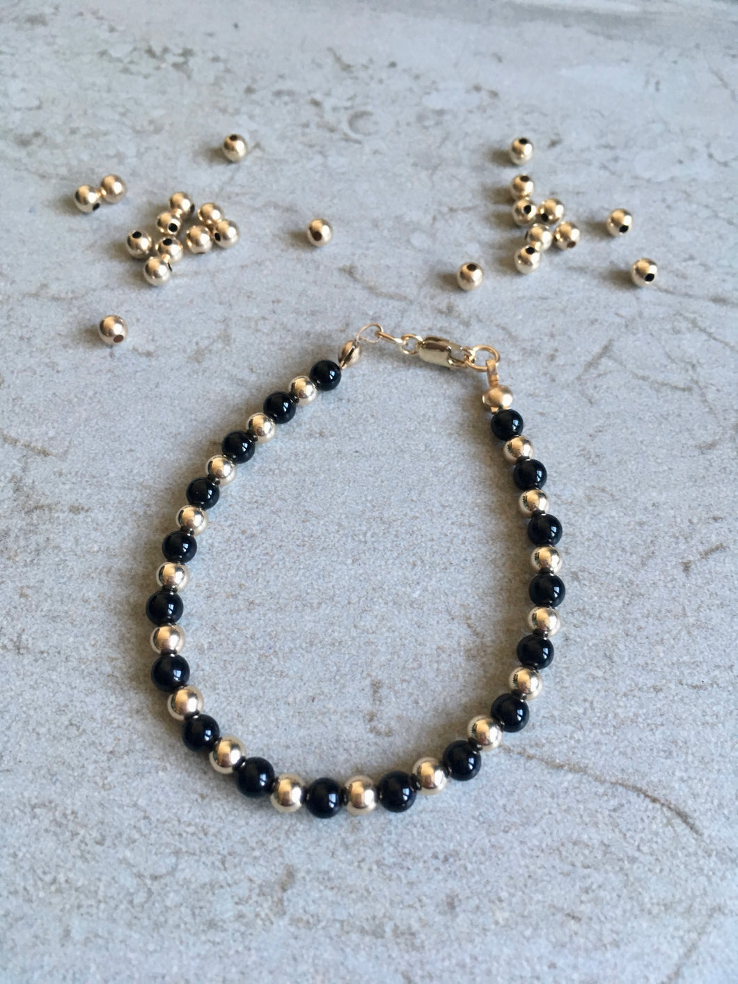 Black Onyx & 9ct Gold Bead Bracelet